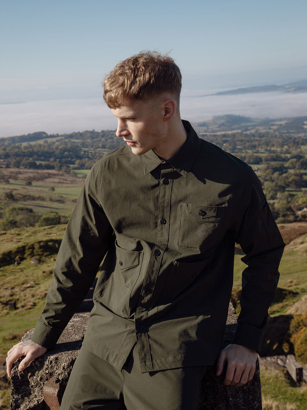Men's green shirt with button-up front.