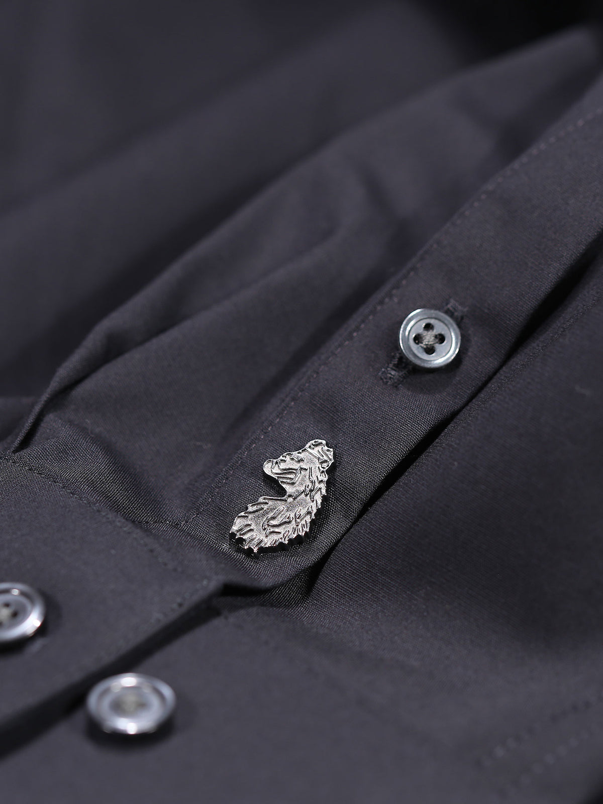 Men's black shirt with button-up front.