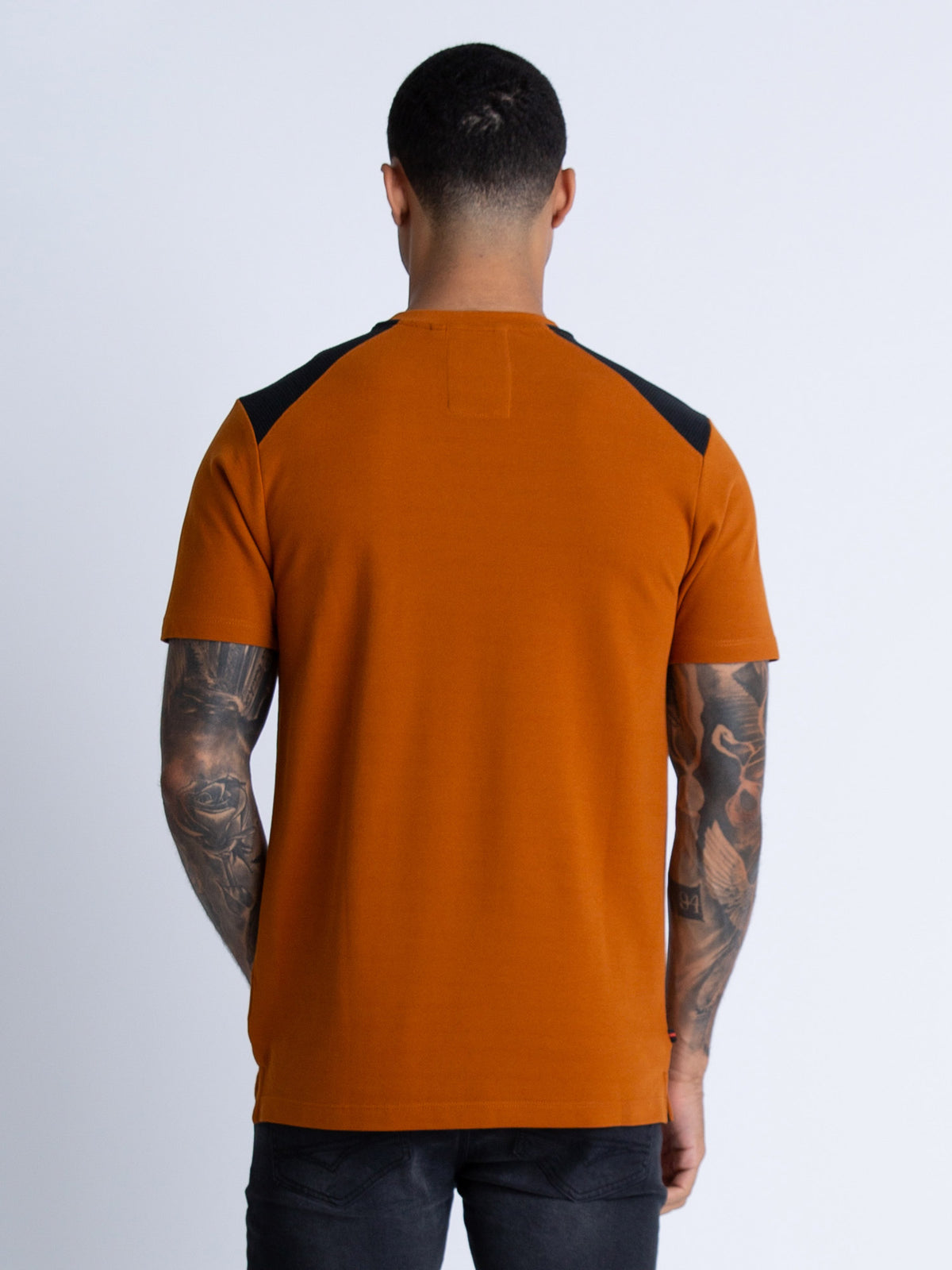 Men's orange t-shirt with crew neck and short sleeves.