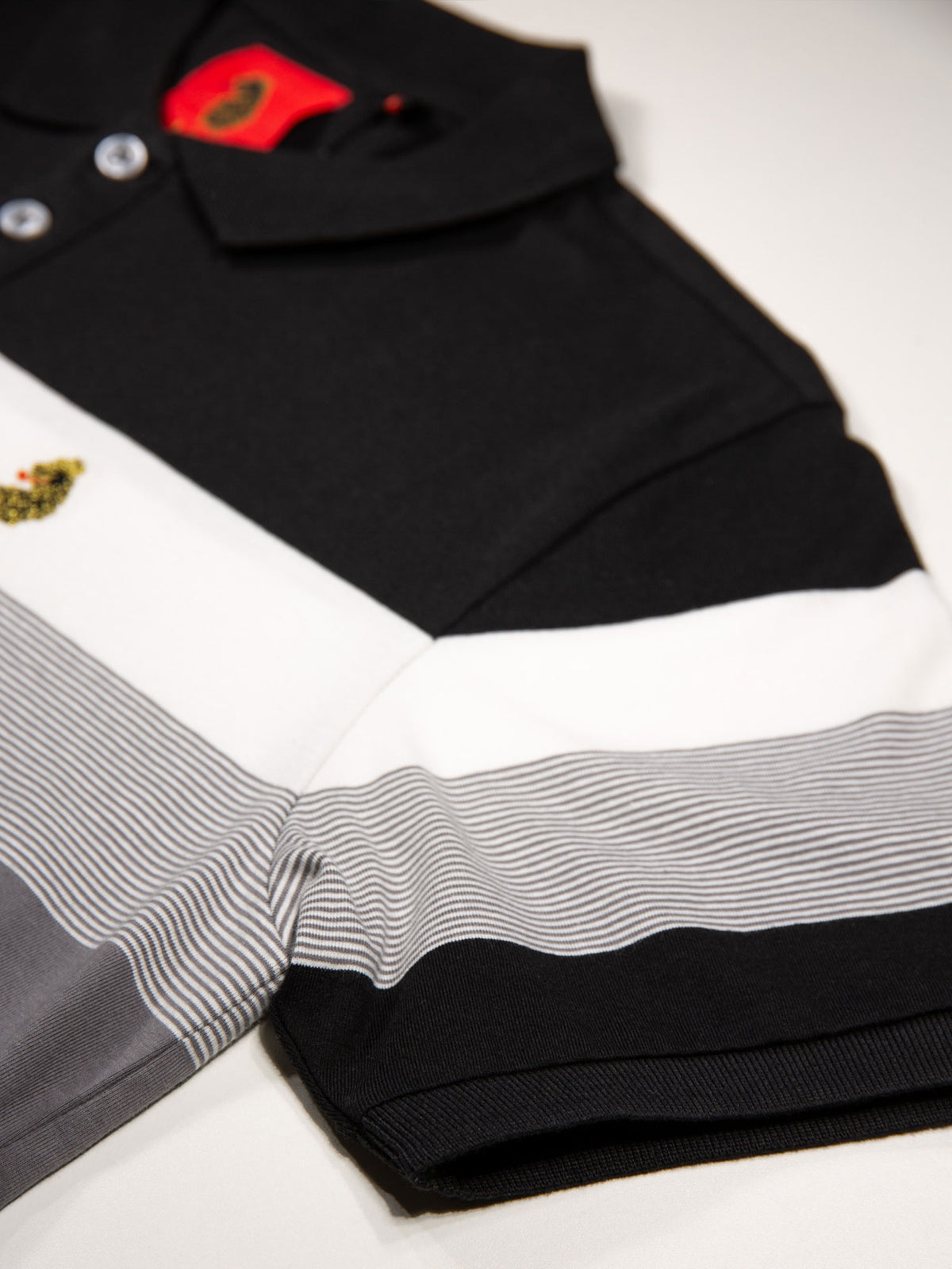 Boy's polo shirt with cotton and striped, sleeve detail view