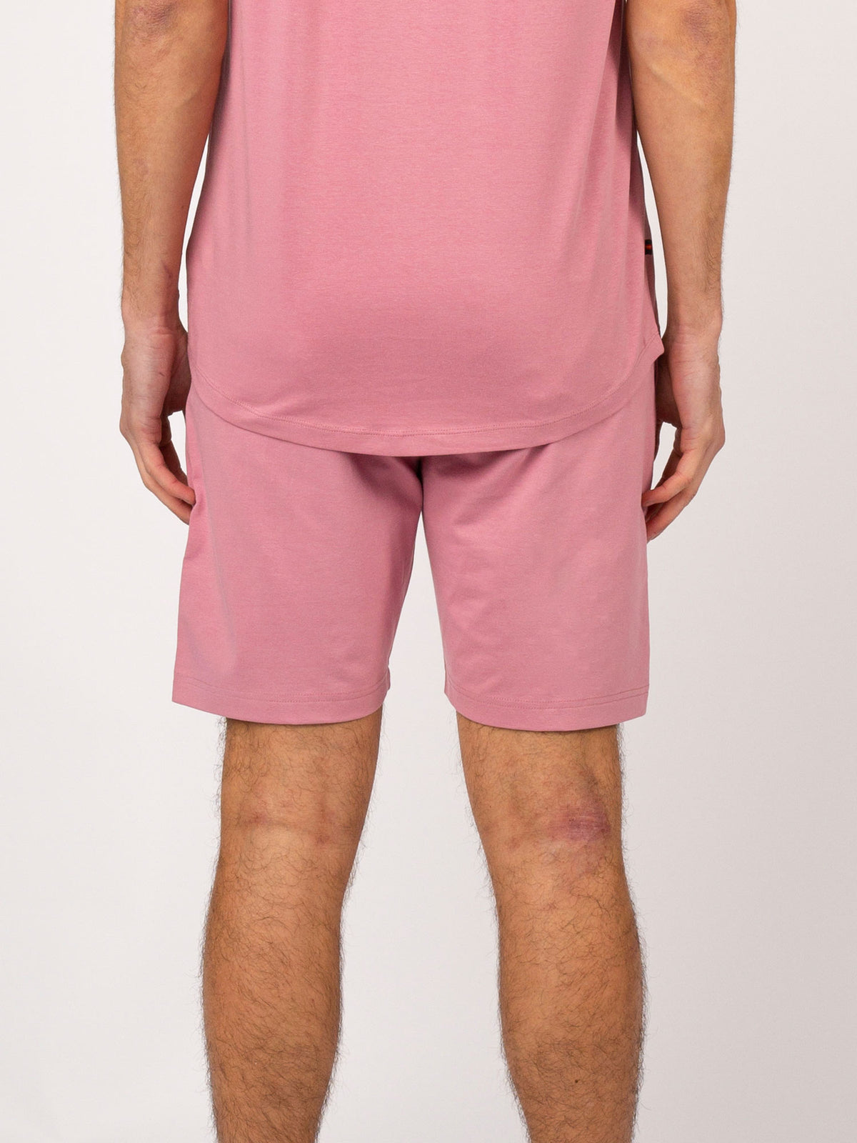 Men's pink shorts with drawstring waistband.