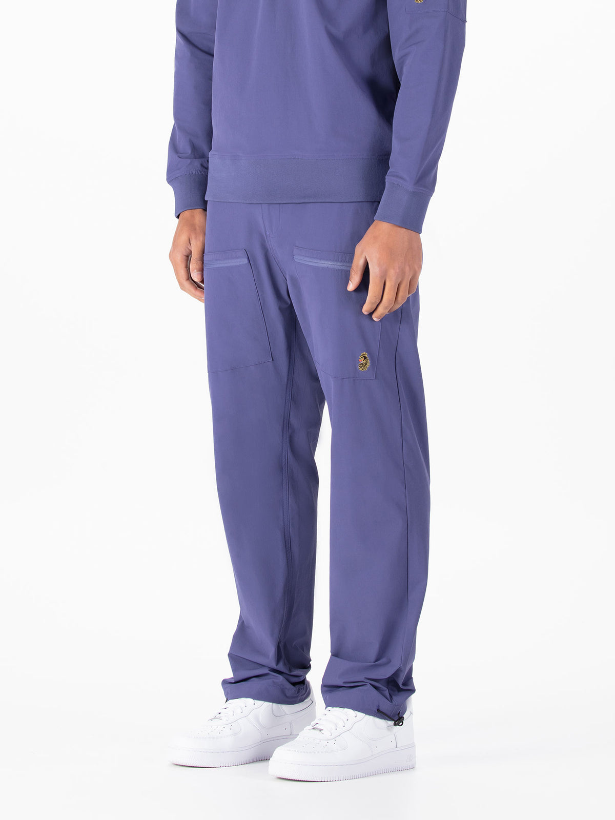Men's purple cargo trousers with cargo pockets.