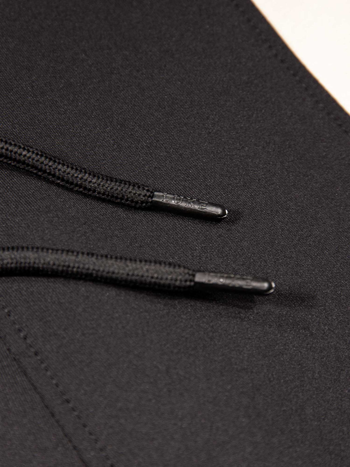 Men's black shorts with drawstring waistband, detail view 2