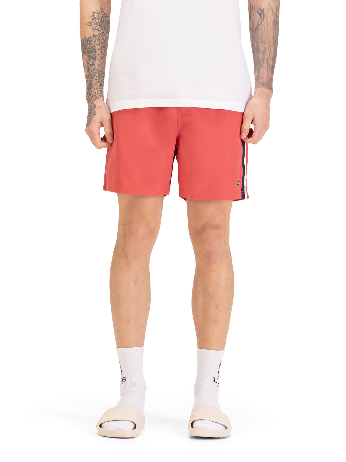 Men's red swim shorts with drawstring waistband, worn by a model, front view