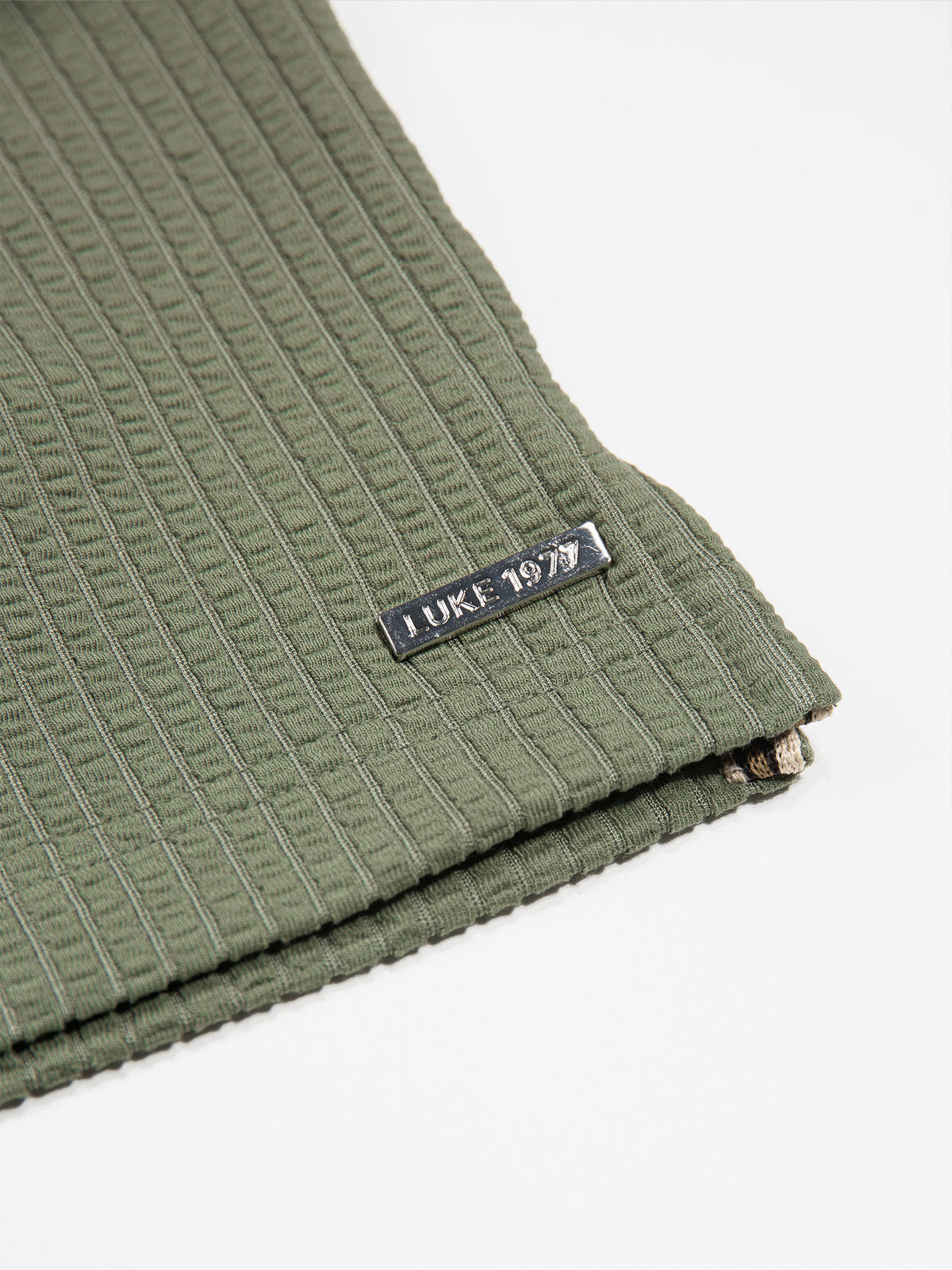 Men's green polo shirt with polo collar.