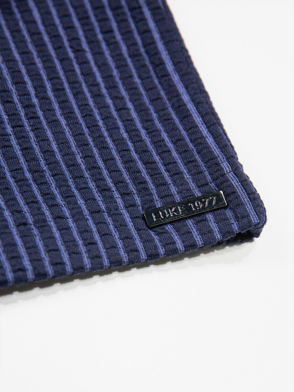 Men's navy polo shirt with polo collar.