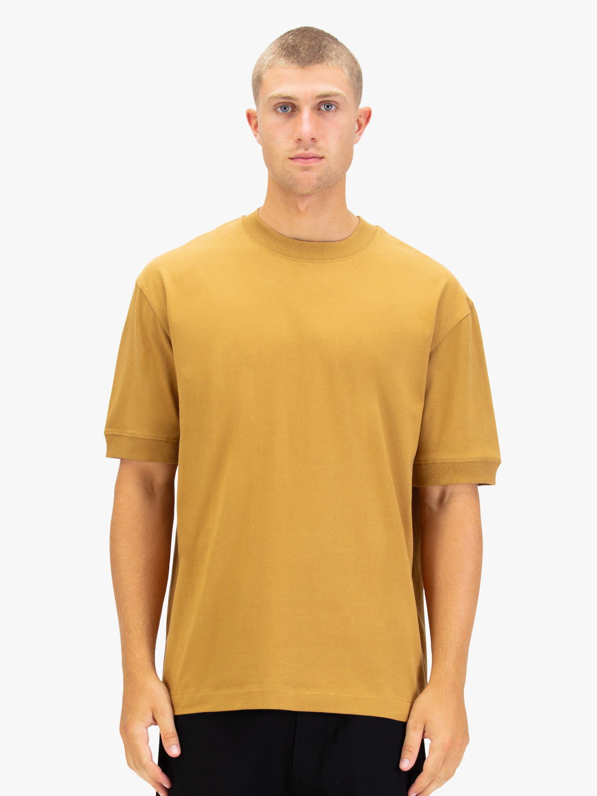 Men's orange t-shirt with crew neck and short sleeves worn by a model - front view.