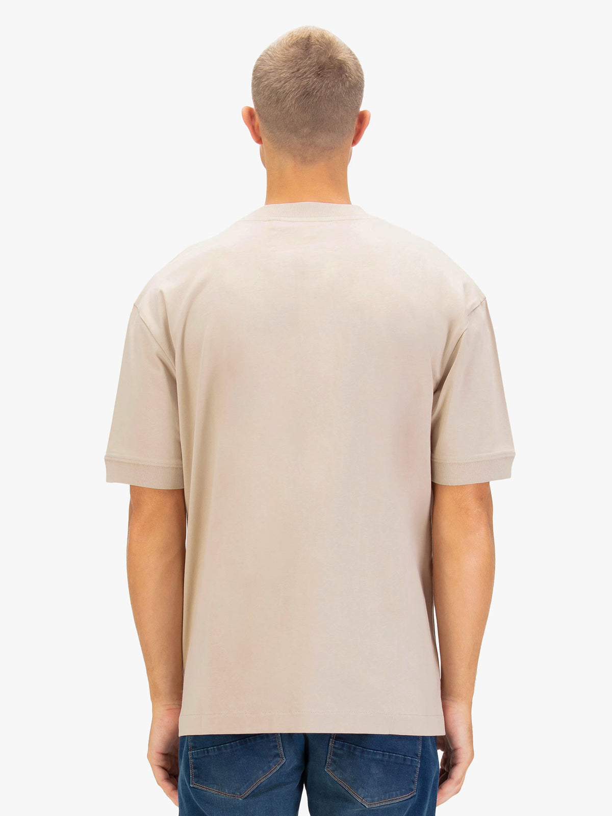 Men's relaxed-fit beige t-shirt with crew neck and short sleeves, worn by a model, back view