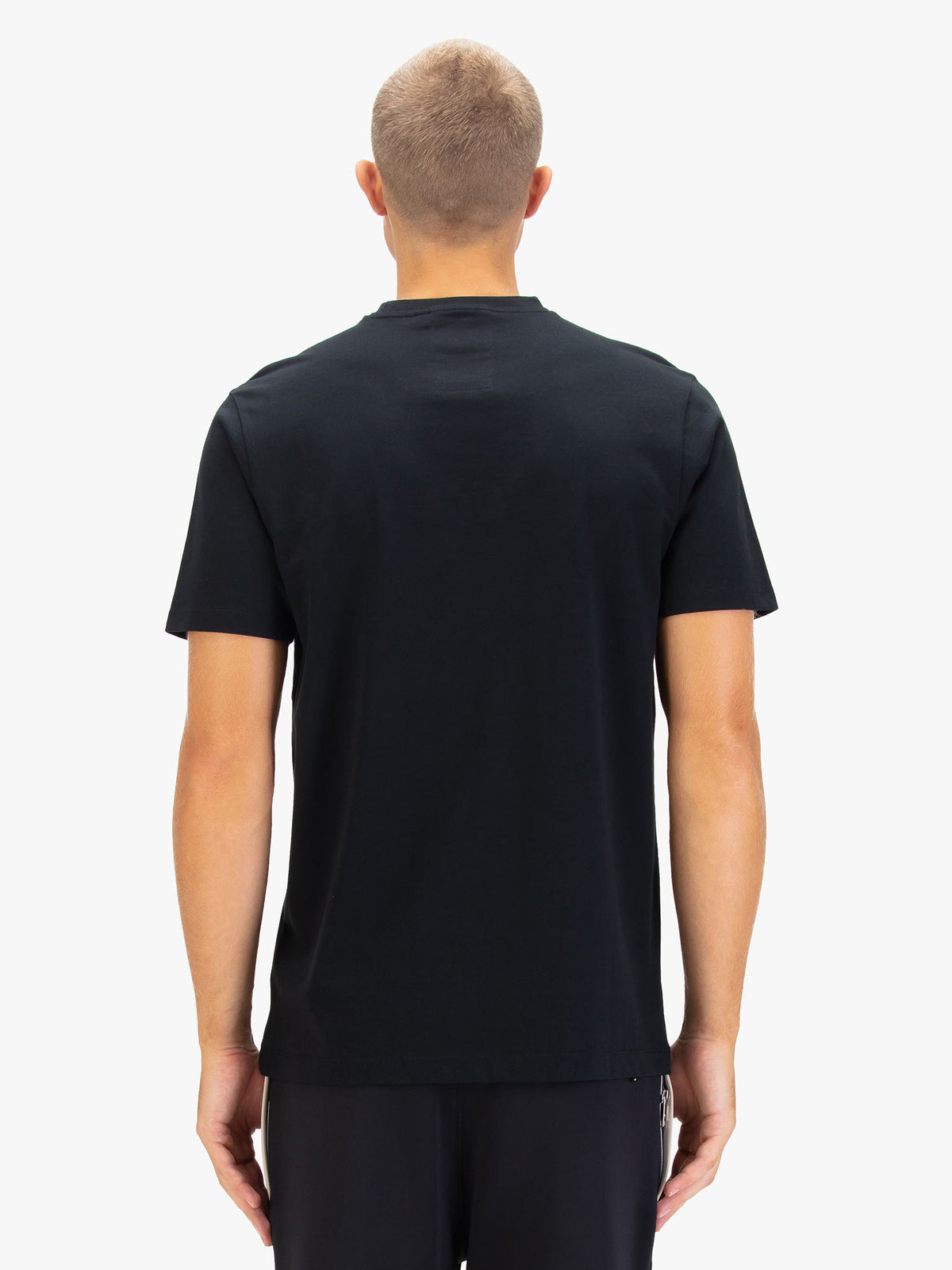 Men's black t-shirt with crew neck and short sleeves, worn by a model, back view