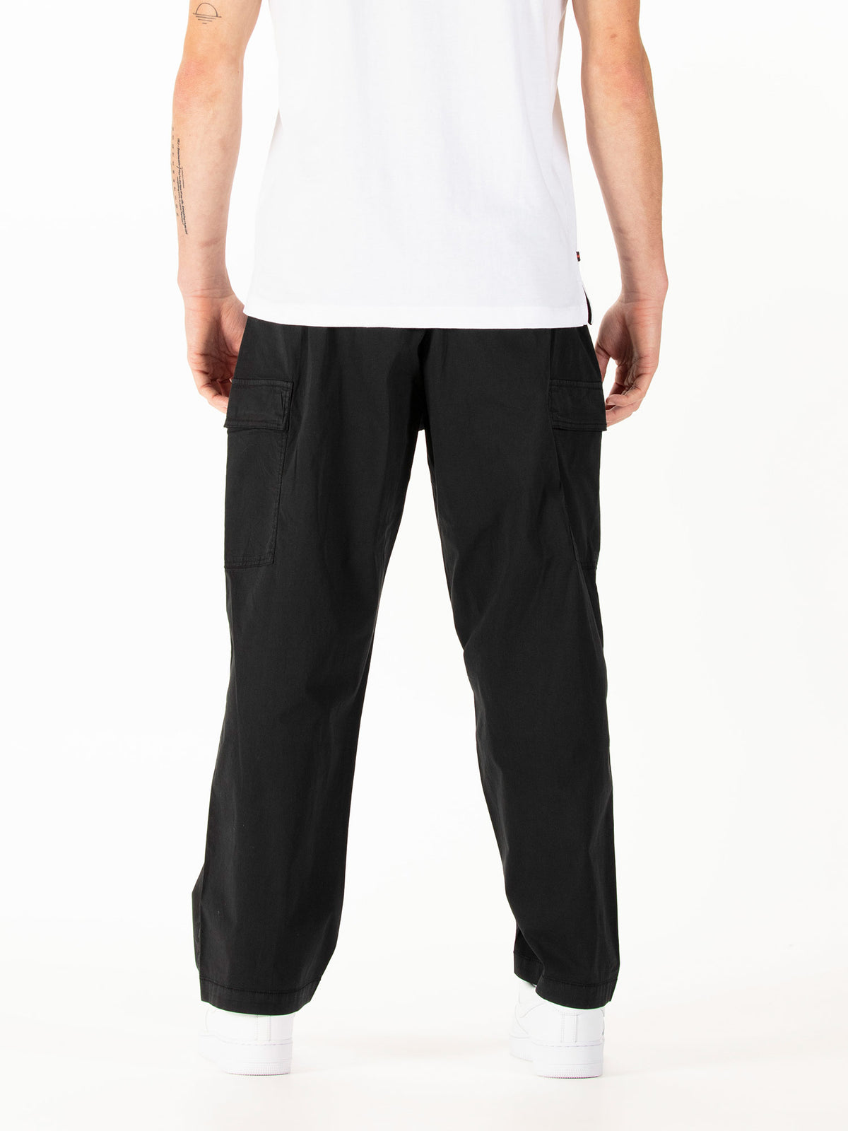 Men's black cargo trousers with cargo pockets.