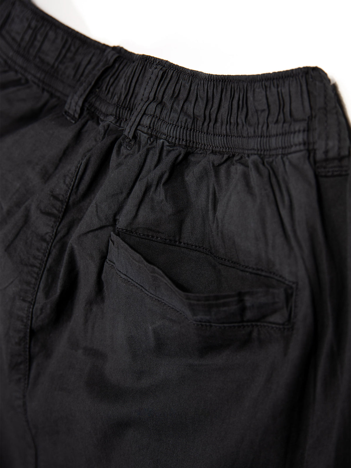 Men's black cargo trousers with cargo pockets.