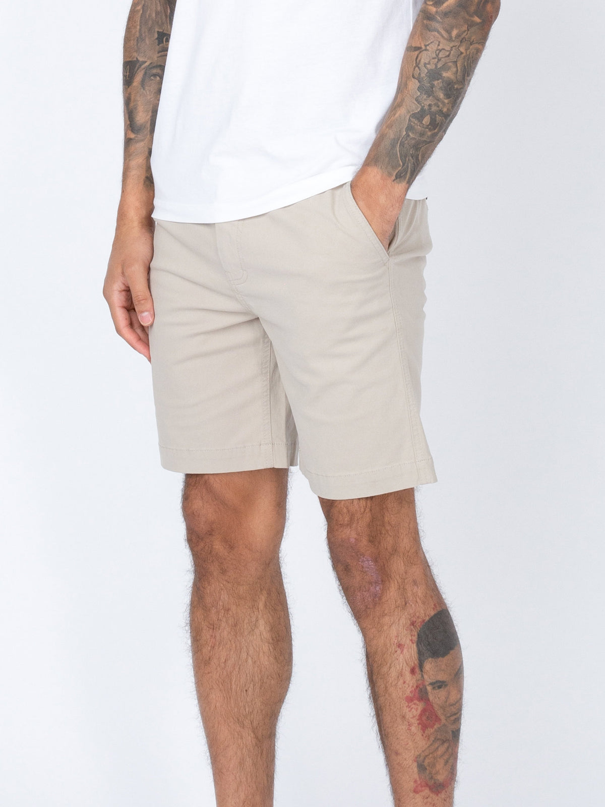 Men's beige shorts with drawstring waistband.