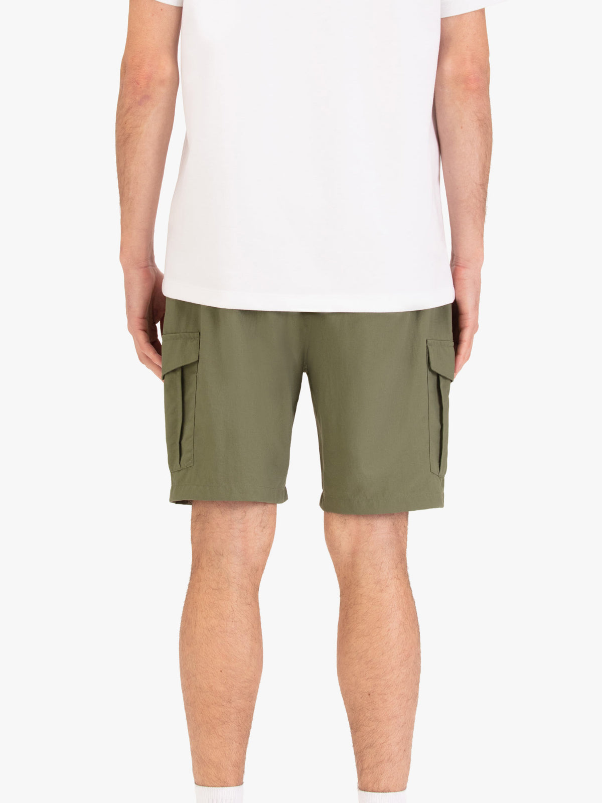 Men's green shorts with elasticated waistband, worn by a model, back view