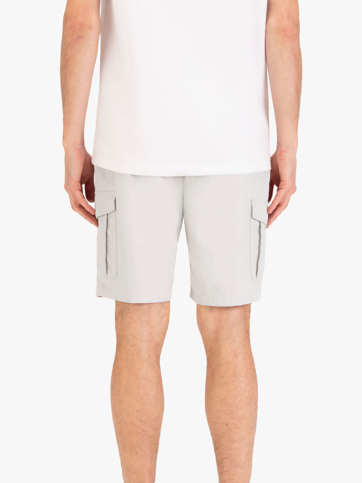 Men's grey shorts with elasticated waistband, worn by a model, back view