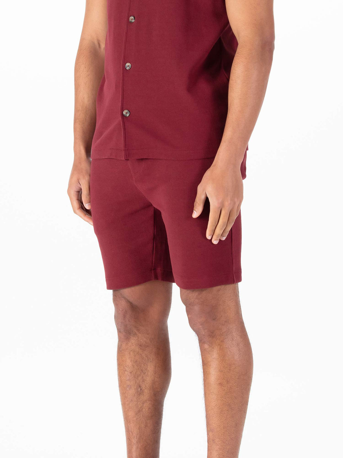 Men's red shorts with drawstring waistband.