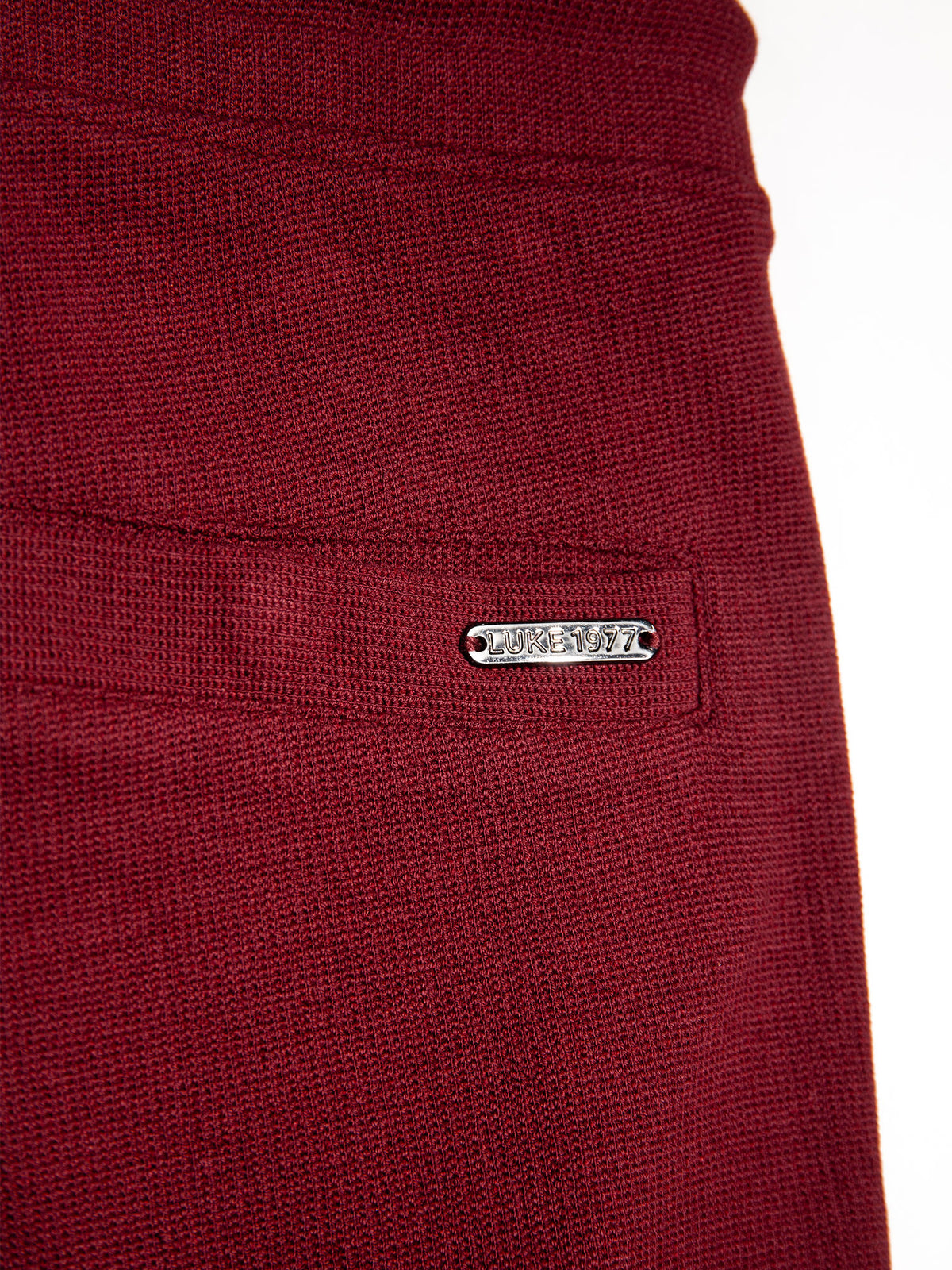 Men's red shorts with drawstring waistband.