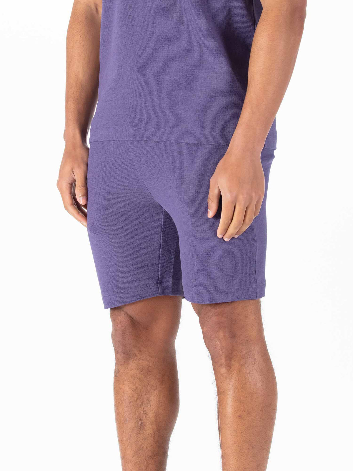 Men's purple shorts with drawstring waistband.