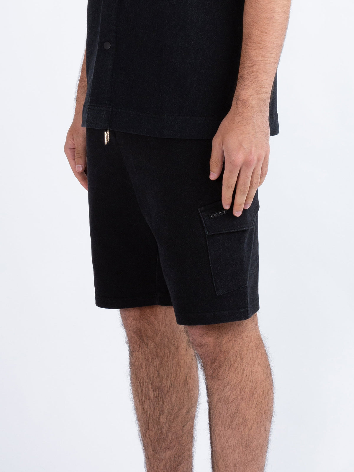 Men's grey shorts with drawstring waistband.