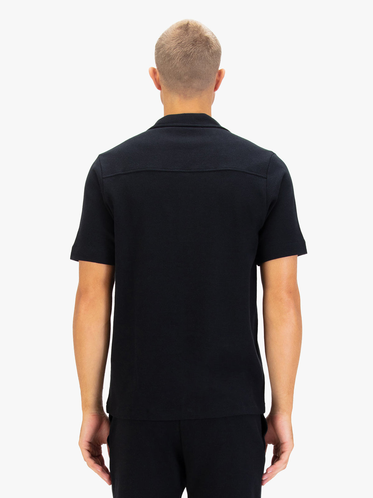 Men's black shirt with button-up front.