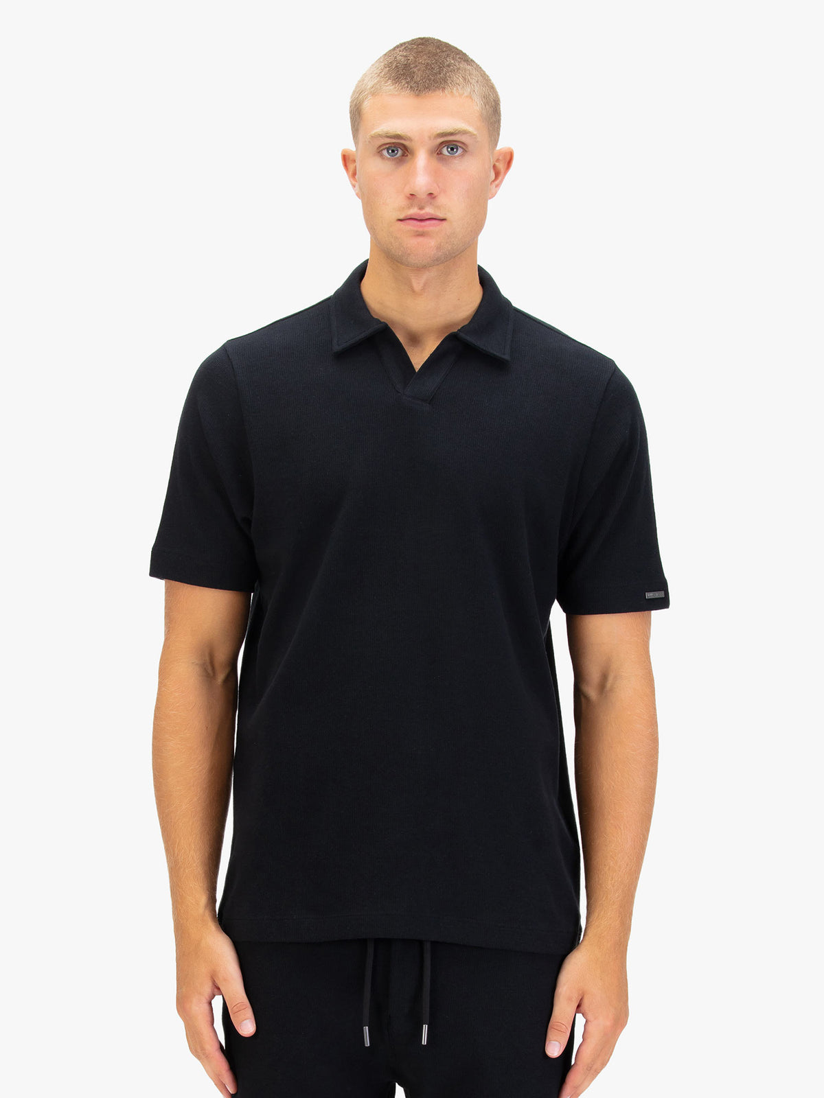 Men's black polo shirt with polo collar.