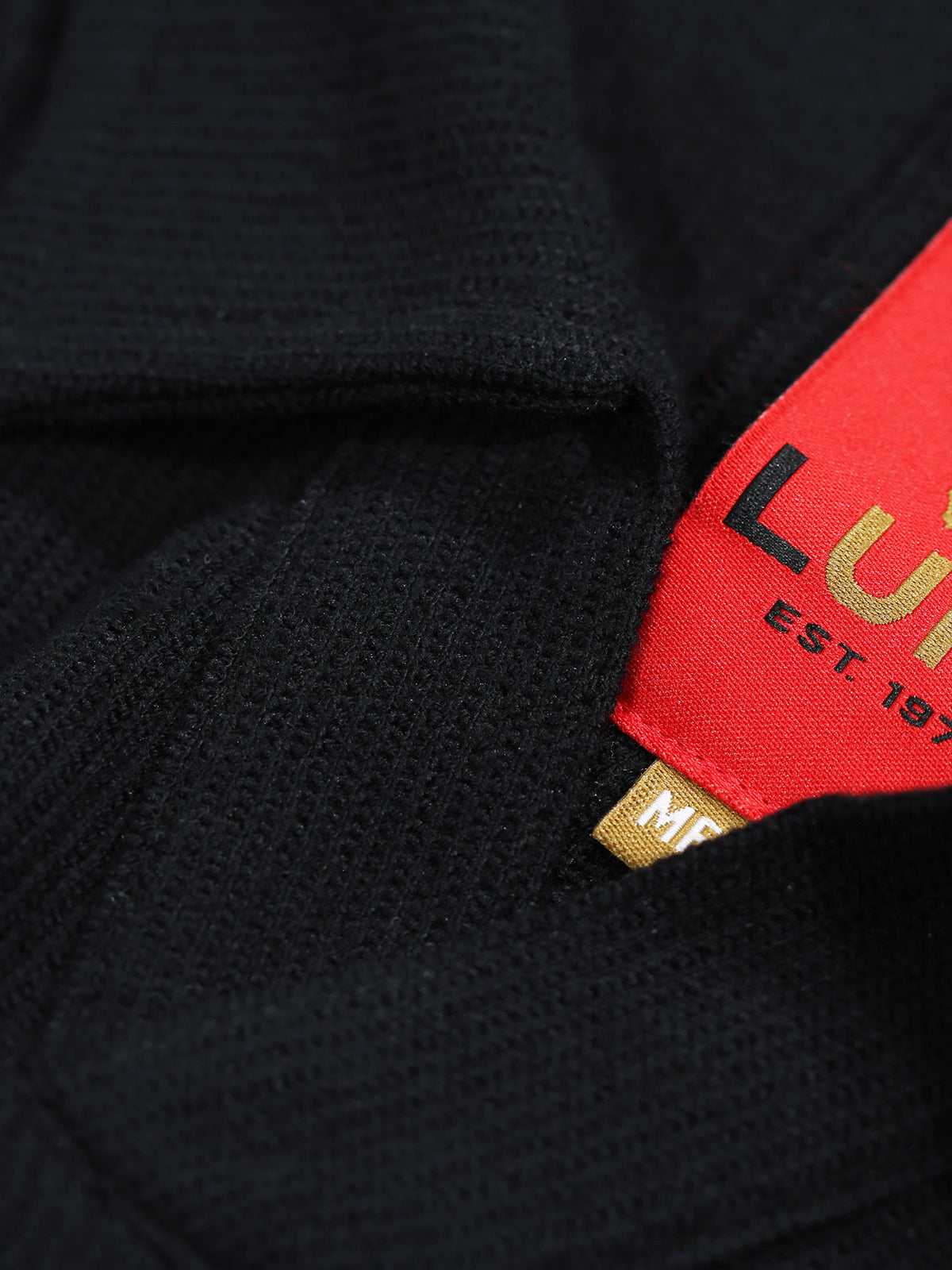 Men's black polo shirt with polo collar.