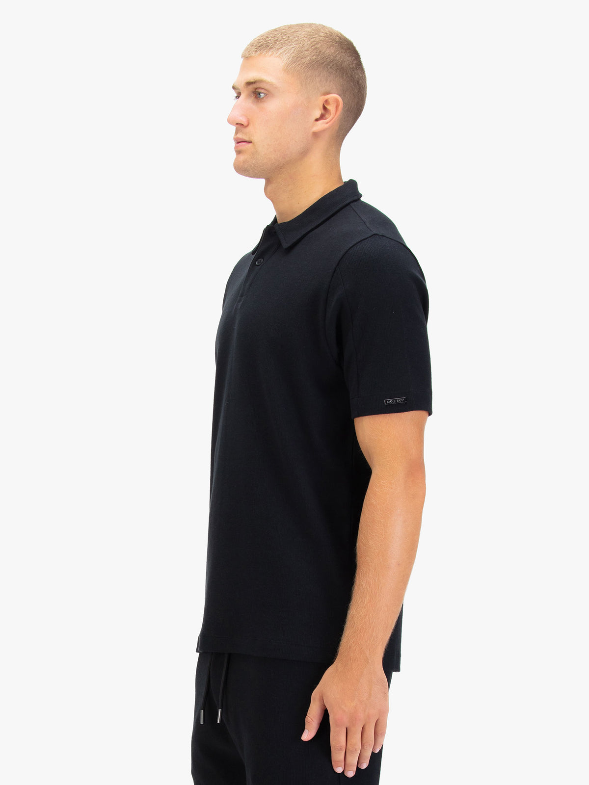 Men's black polo shirt with polo collar.