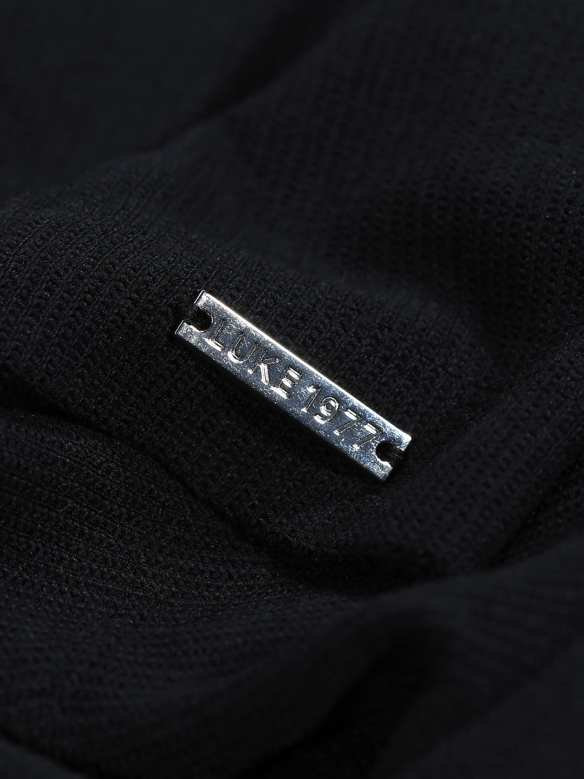 Men's black polo shirt with polo collar.