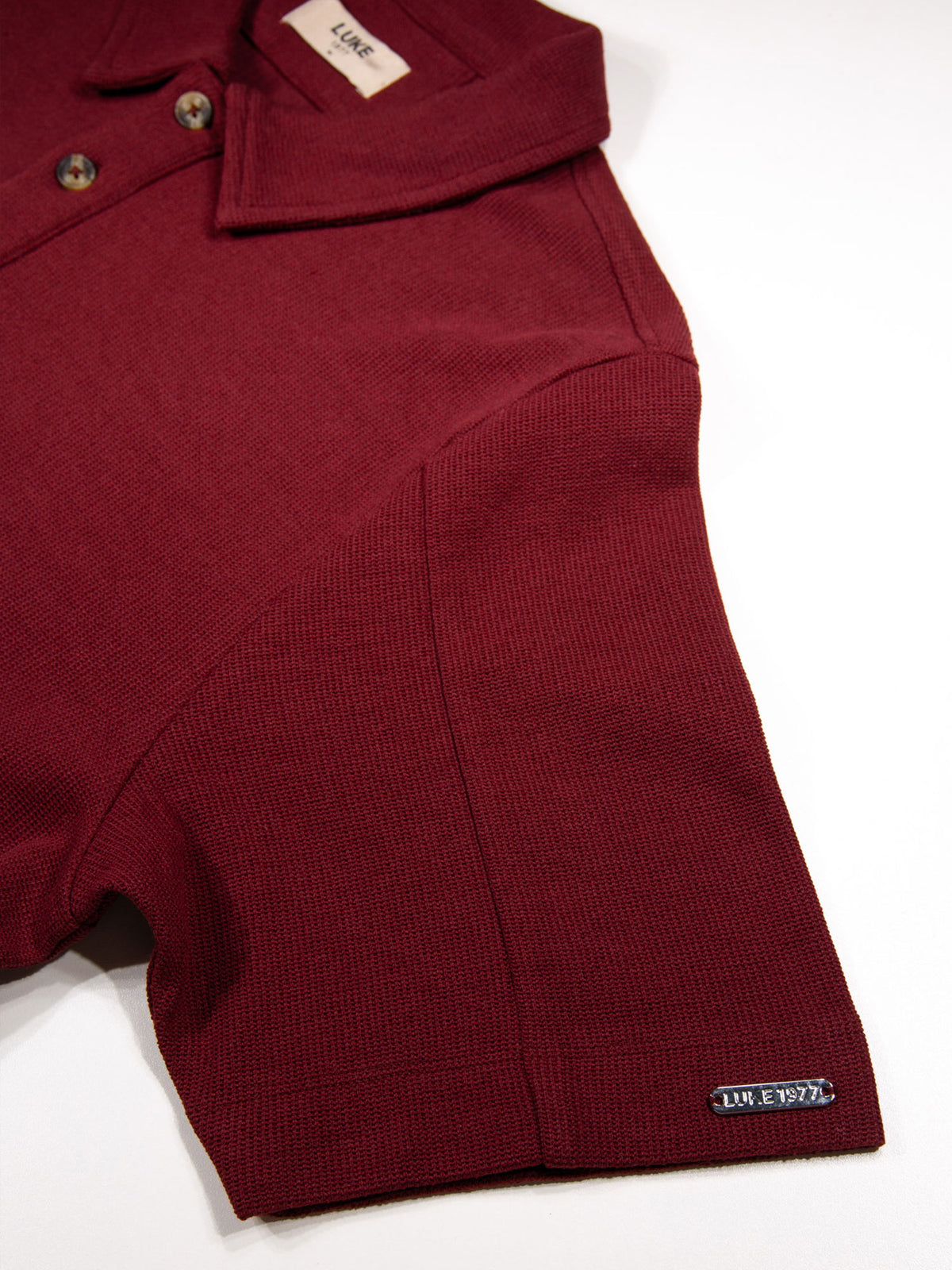 Men's red polo shirt with polo collar.