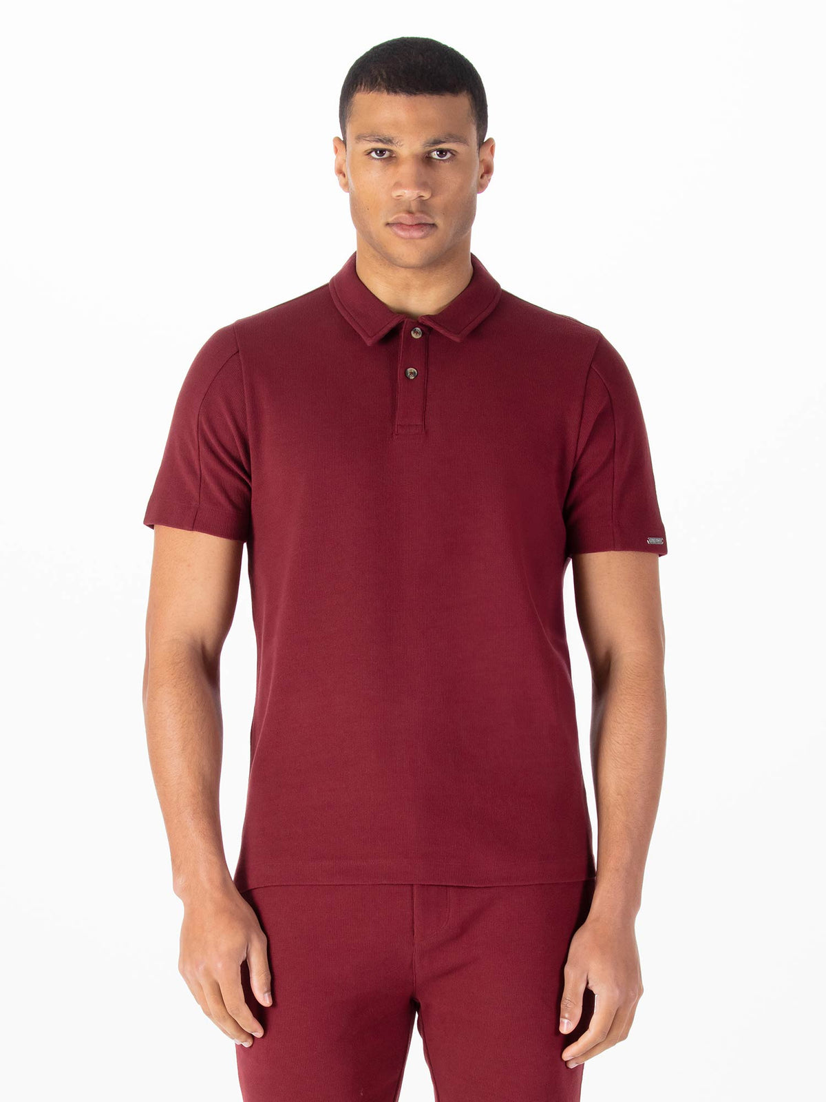 Men's red polo shirt with polo collar.