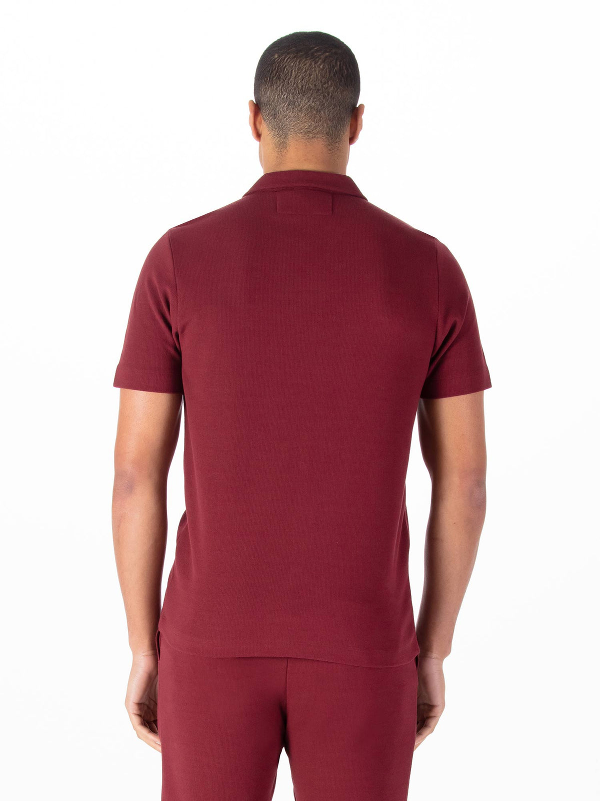 Men's red polo shirt with polo collar.