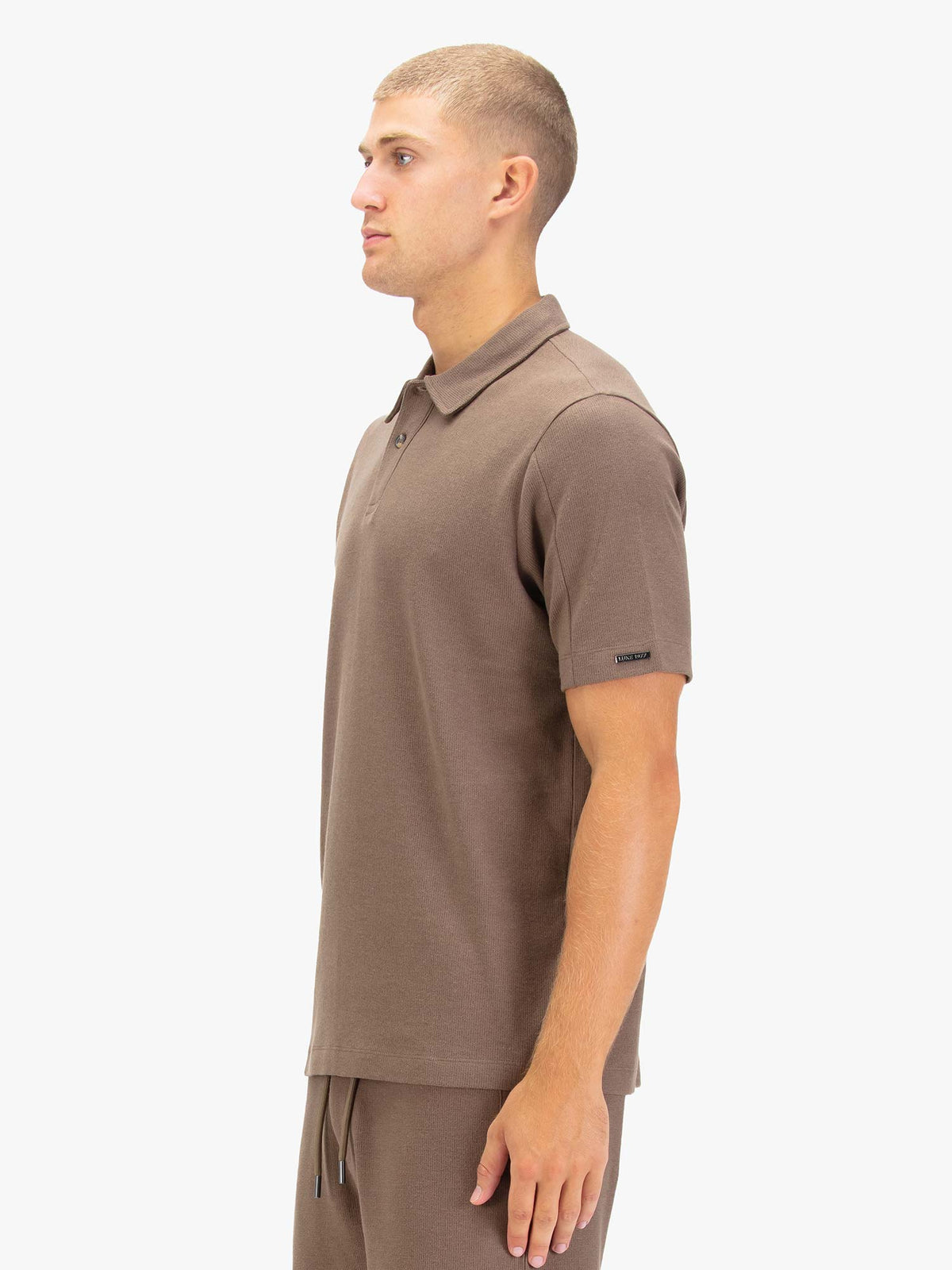 Men's brown polo shirt with polo collar.