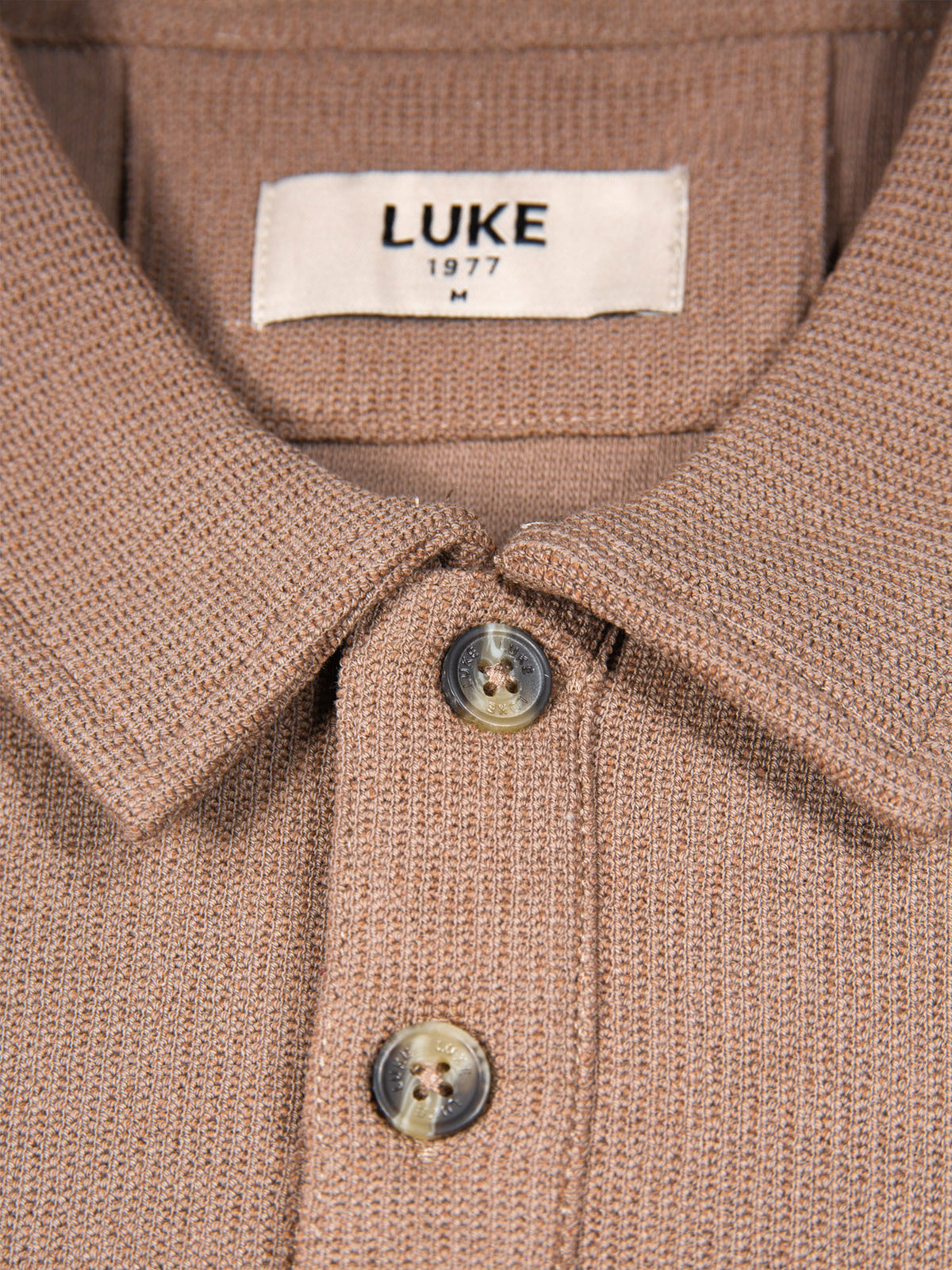 Men's brown polo shirt with polo collar.