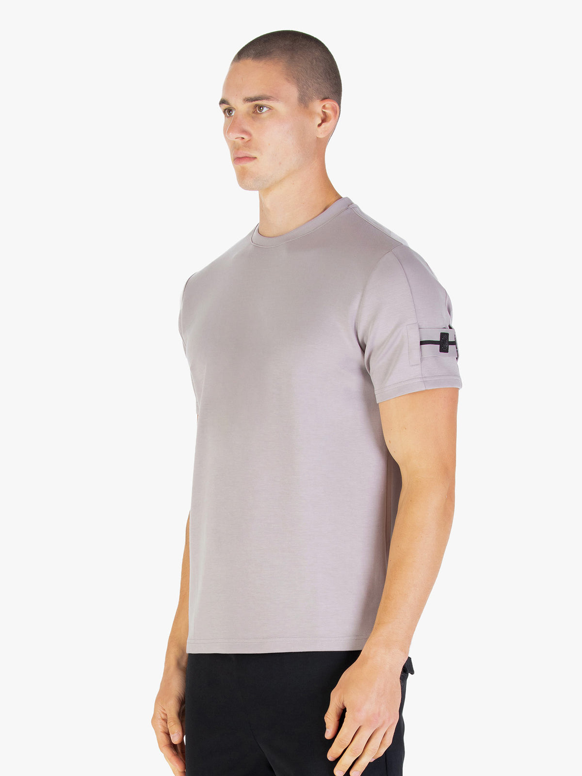 Men's grey t-shirt with crew neck and short sleeves worn by a model - side view.