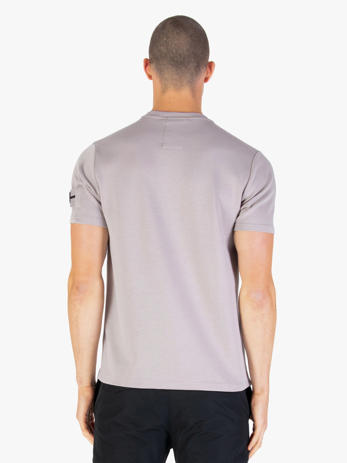Men's grey t-shirt with crew neck and short sleeves worn by a model - back view.