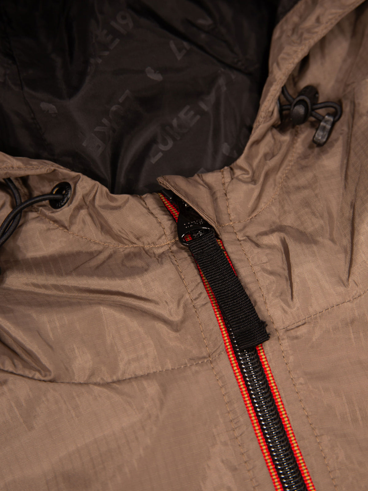 Men's brown jacket with zip-up front.