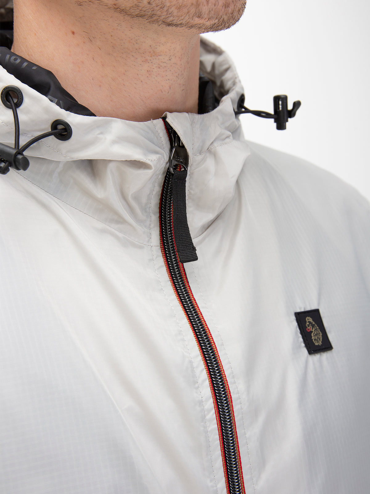 Men's grey jacket with zip-up front, worn by a model