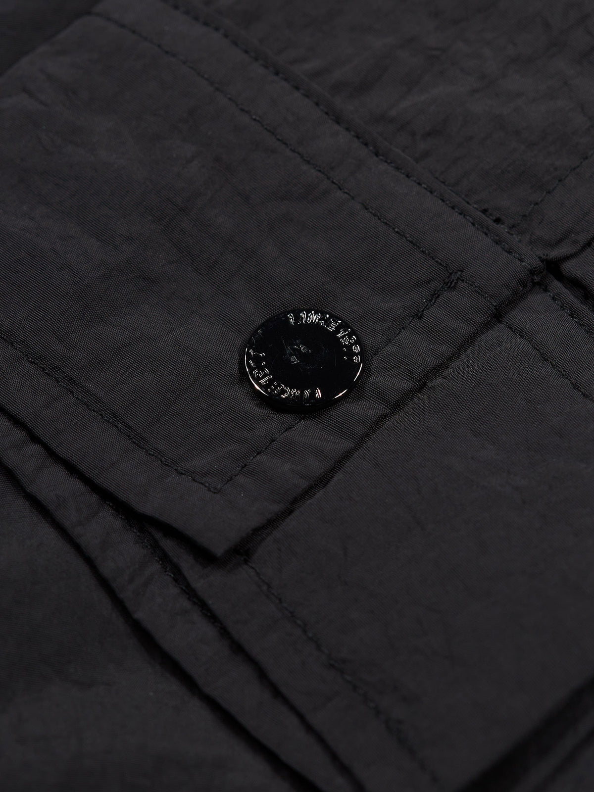 Men's black jacket with button-up front and chest pocket.