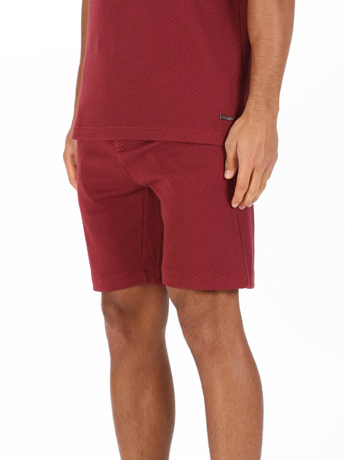 Men's red shorts with drawstring waistband.
