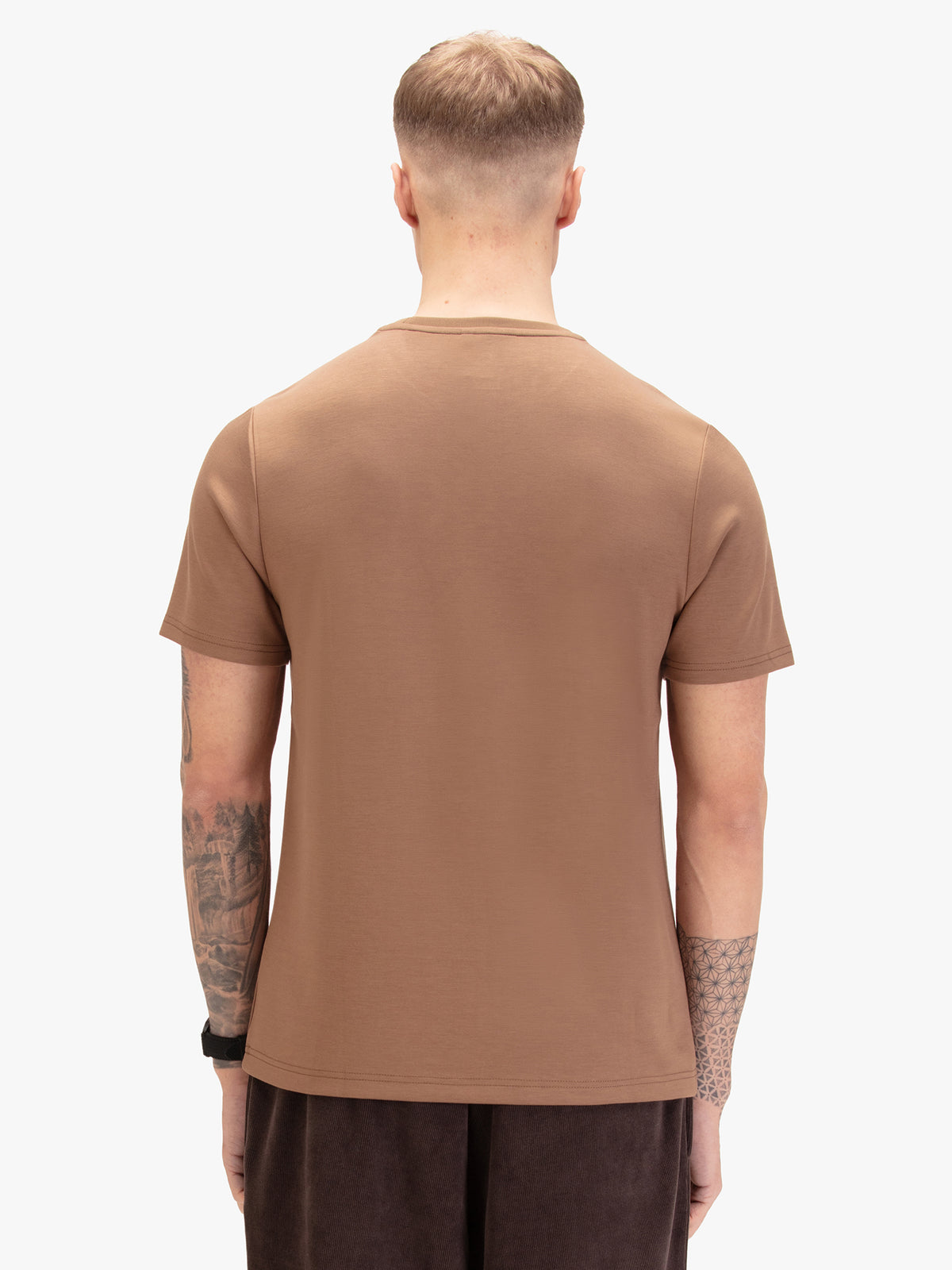 Men's brown t-shirt with crew neck and short sleeves worn by a model - back view.