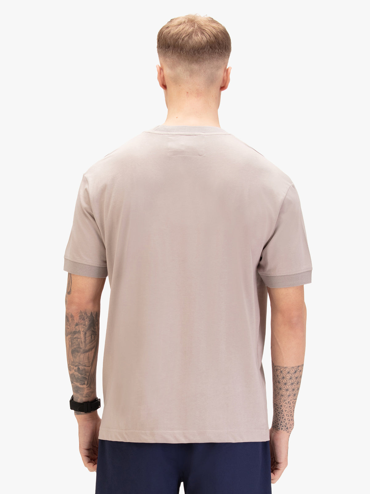 Men's grey t-shirt with crew neck and short sleeves worn by a model - back view.