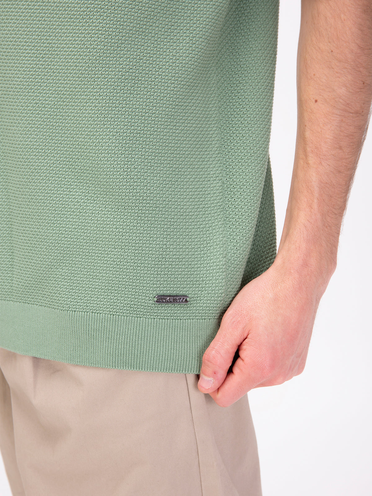 Men's relaxed-fit green t-shirt with crew neck and short sleeves, worn by a model