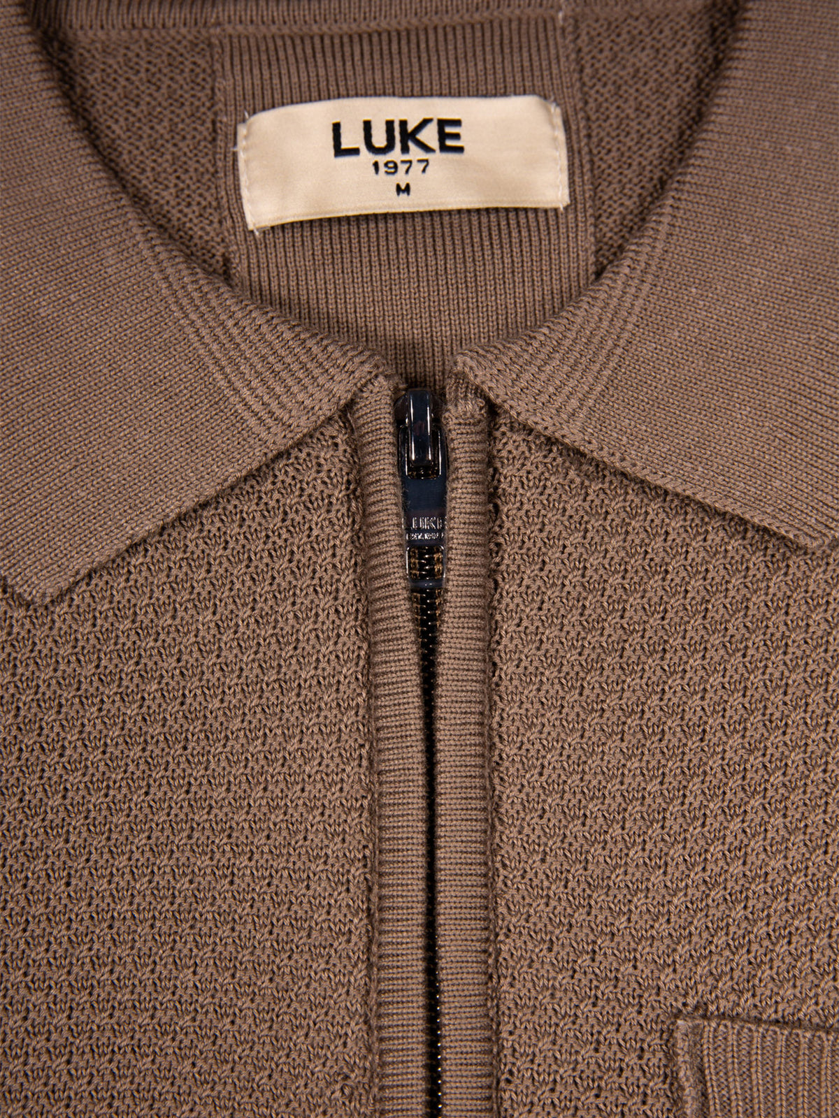 Men's brown knitted polo with polo collar.