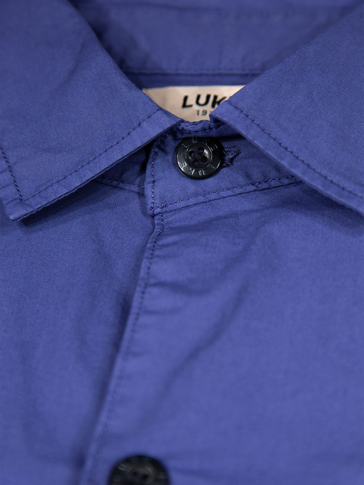 Men's purple shirt with button-up front.