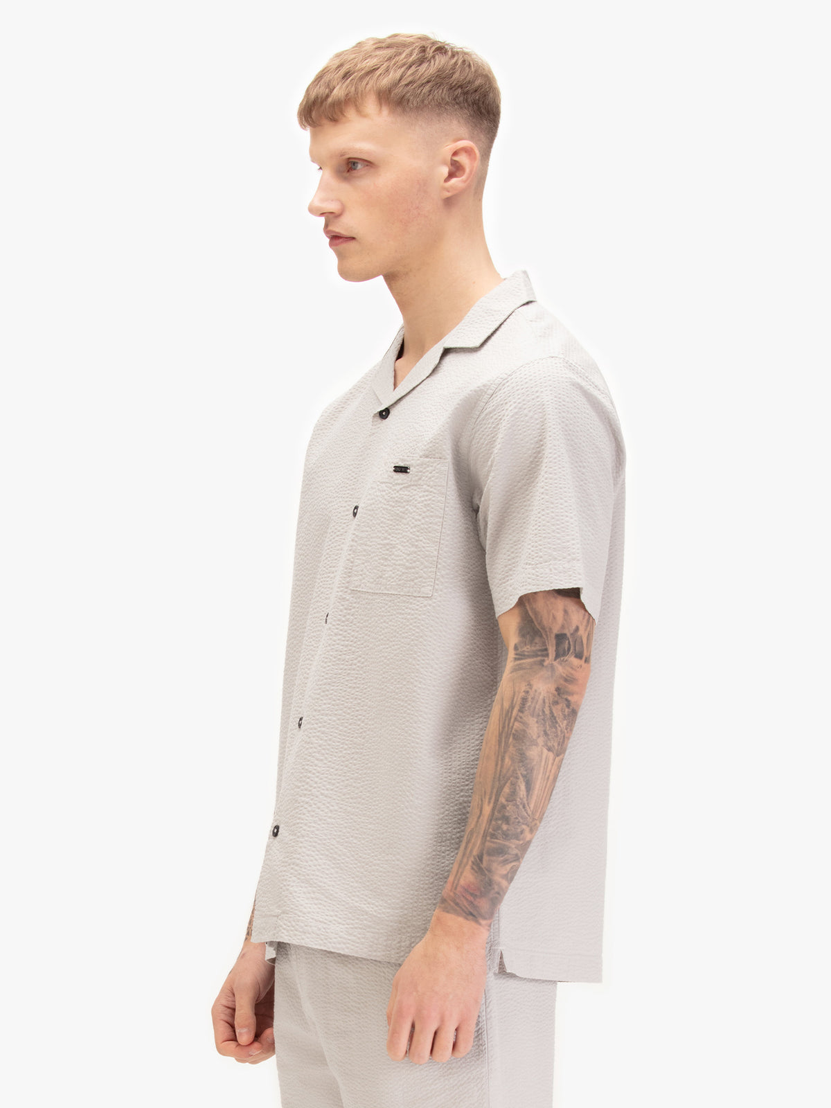 Men's grey shirt with button-up front, back view