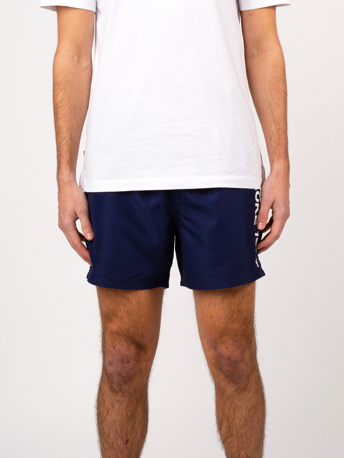 Men's navy swim shorts with drawstring waistband.