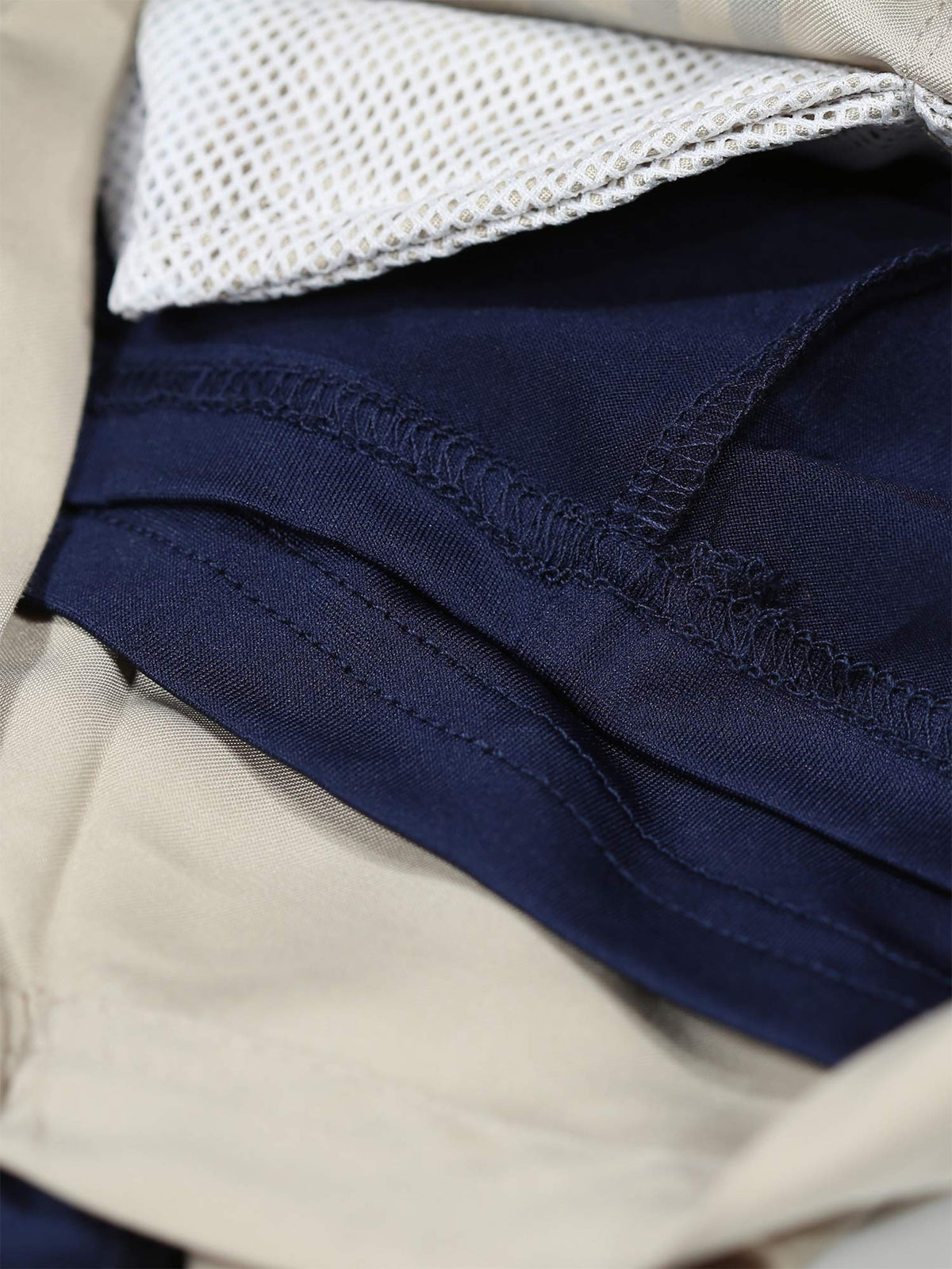 Men's beige swim shorts with drawstring waistband.