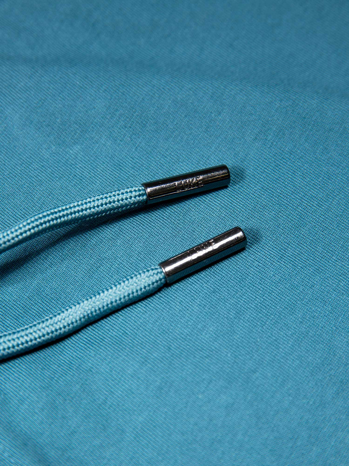 Men's blue short set with short-sleeve shirt and drawstring shorts, detail view.