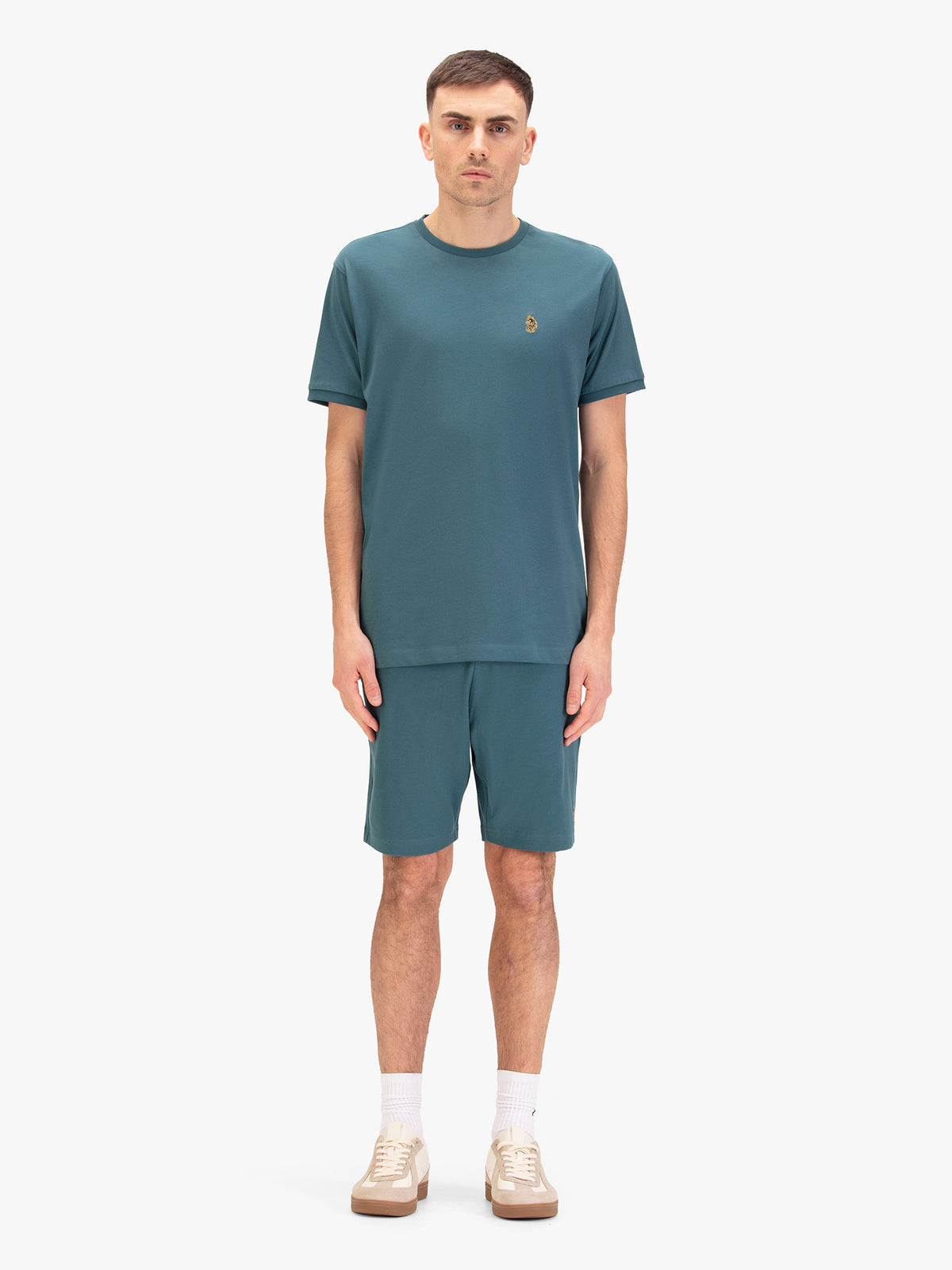 Men's blue short set with short-sleeve shirt and drawstring shorts, worn by model.