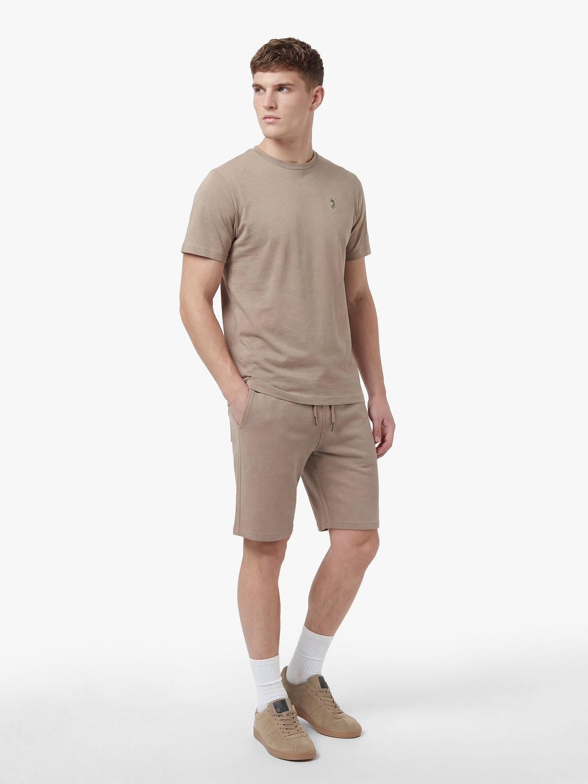 Men's brown short set with short-sleeve shirt and drawstring shorts, worn by model.