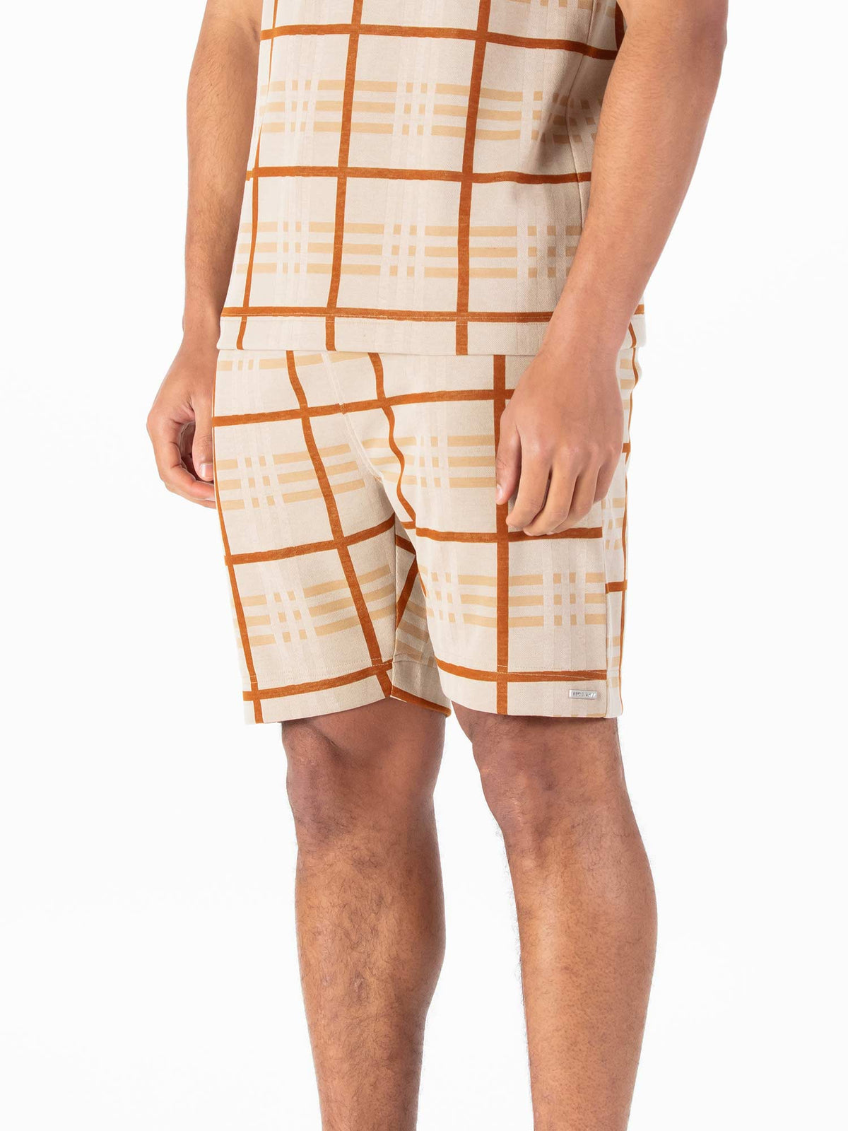Men's beige shorts with drawstring waistband.